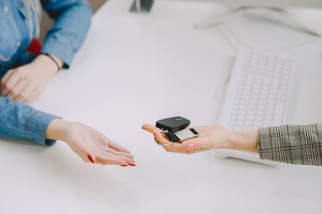 Stylish and elegant women in a car salon