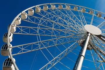 The White Ferris Wheel Over Blue Sky