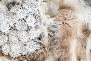 Fashion accessories handmade silver metal belt placed on brown fur texture background.