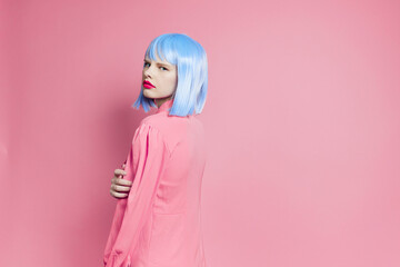 glamorous woman in blue wig pink dress red lips studio model