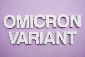 Omicron Variant alphabet letters on purple background