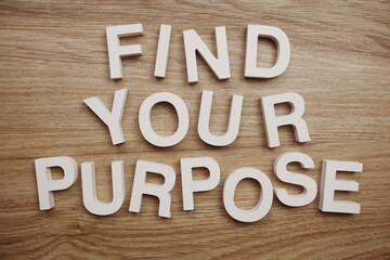 Find Your Purpose alphabet letters on wooden background