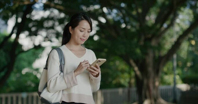 Asian woman use smart phone at outdoor