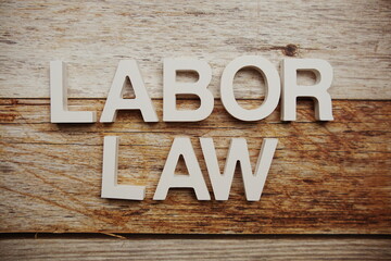Labor Law alphabet letters on wooden background