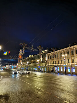 Nevsky Prospect and the Dumskaya Tower of St. Petersburg in an early winter morning. Decorated with garlands for Christmas and New Years, but they are not lit yet.