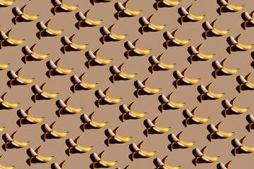 Pattern bananas. Fresh ripe wet bananas fruit, water drops, yellow background