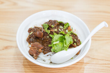 Stir fried beef brisket, rice noodles and rice sticks in a bowl
