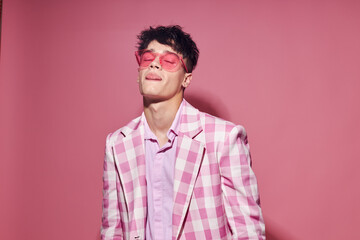 Fototapeta premium pretty man self confidence pink plaid blazer fashion posing isolated background unaltered