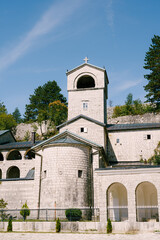 Fototapeta na wymiar Ancient monastery in Cetinje surrounded by green trees. Montenegro