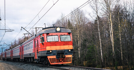 Electric train close-up in the autumn forest