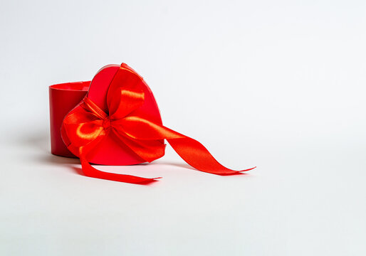Gift red box in the form of a heart on a white background.