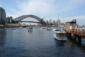 Fototapeta na wymiar Beautiful scenic view of Sydney City Center, Harbour Bridge, Luna Park, boats and yachts from Lavender Bay. 