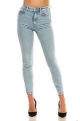Front view of pretty female legs in jeans and shoes