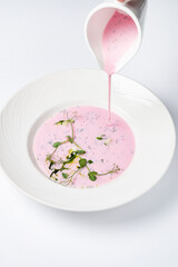cold beetroot soup on the white background