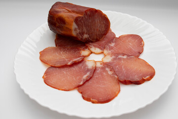 Iberian loin cane. Portion of Iberian loin. The best Spanish sausage, in high demand. Isolated on white background.