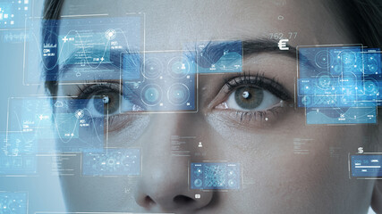 Young woman watching hologram screens. Biometrics concept. Personal authentication.