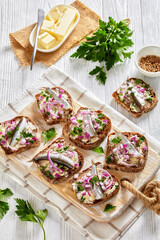 pickled sprat rye bread open sandwiches, top view