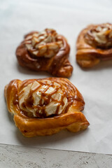 Bakery pastries on white background. Freshly cooked bakery. Home cooked bakery for morning breakfast. Copy space. Selective focus