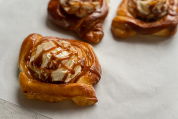 Bakery pastries on white background. Freshly cooked bakery. Home cooked bakery for morning breakfast. Copy space. Selective focus