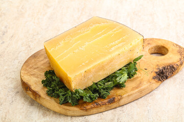 Parmesan cheese piece over board