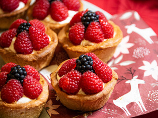Freshly baked baskets with curd cream and strawberries