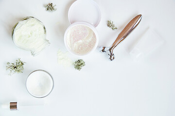 Alginate mask and transparent patches. Wellness face care cosmetics set on white gradient background. Cream and massager. Natural moss. Hyaluronic and moisturizing cosmetic. Dermatology products