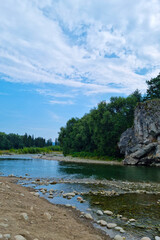 Beautiful little mountain river on a sunny summer day. Clear clean water.