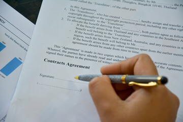 business contract agreement document form for sign with hand and pen