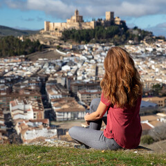Fototapeta na wymiar woman tourist enjoying view of castle- Andalousia