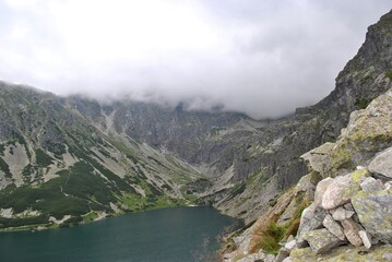 Naklejka na ściany i meble Beautiful lake in the national park. Tatry mountains. Spring Summer. 