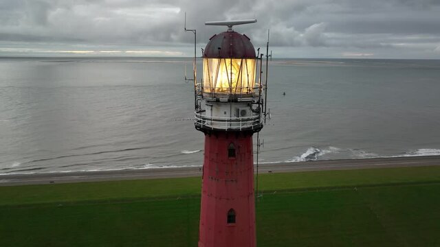 Lighthouse tower Lange Jaap in Den Helder drone aerial footage 5K along the sea near the island of Texel in North Holland, The Netherlands.