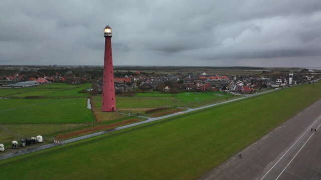Lighthouse tower Lange Jaap in Den Helder drone aerial footage 5K along the sea near the island of Texel in North Holland, The Netherlands.