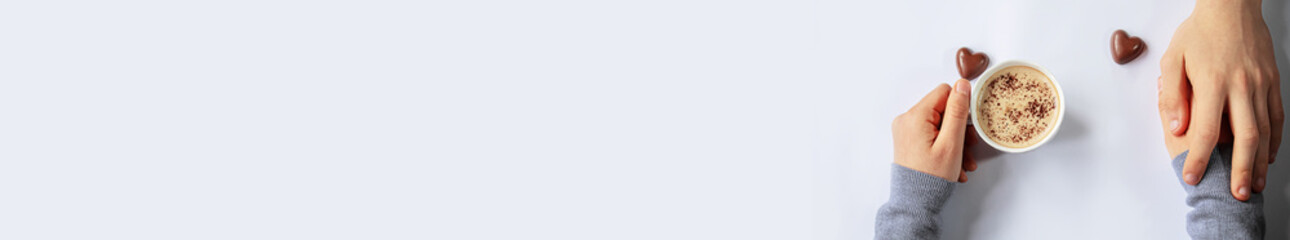 Cup drink for Breakfast in the hands of lovers. Selective focus.