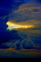 Naklejka premium sky, sunset, clouds, cloud, sun, sunrise, nature, blue, landscape, orange, light, cloudscape, weather, sunlight, color, red, evening, dusk, dramatic, beautiful, abstract, beauty, summer, bright, horiz