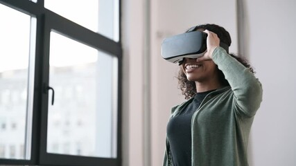 Young woman using virtual reality headset at home, VR, future, gadgets, technology, virtual event, education, study, learning, video game concept.