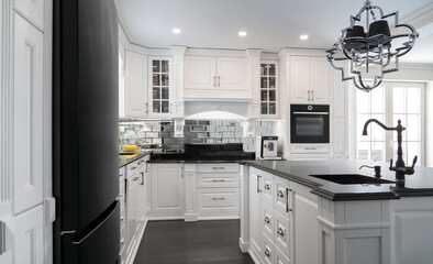 Beautiful, white, wooden kitchen with large island