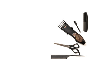 flat lay with hair clipper and hairdressing tools, on white
