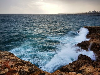 waves breaking on the rocks
