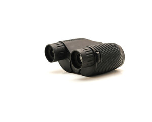 Side view a black compact Binoculars with rubber armor ergonomic steady grip isolated on white