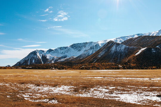 High cliffs in the mountains with snow on the peaks in Altai