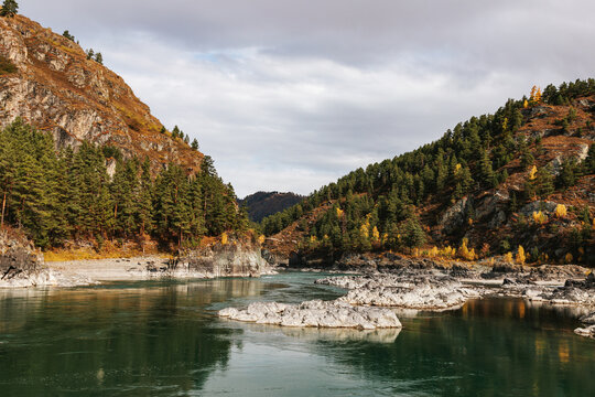 Mountain river surrounded by high rocks in Altai