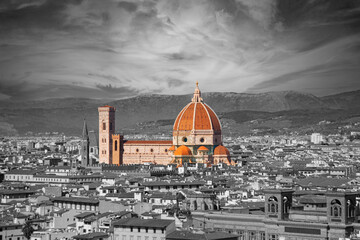 Fototapeta na wymiar Santa Maria del Fiore cathedral in Florence, Italy. Selective color - cathedral, dome and tower in color and city in black and white. Aerial panoramic view.