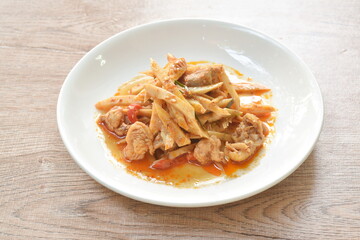 spicy stir fried bamboo shoot and chicken with curry on plate