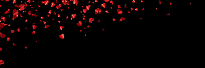 Red foil hearts confetti on black background.