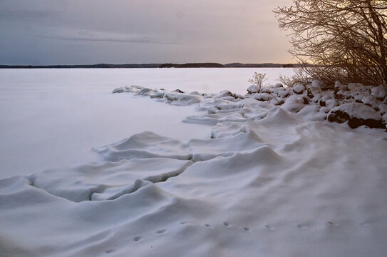 Frozen big winter lake, Vanaja Finland during winter. Freezing cold weather 