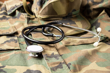 Shot of stethoscope lies on the uniform of a US soldier. The concept of health care, military insurance, state care