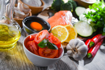 Fresh food ingredients prepared for cooking on a kitchen table