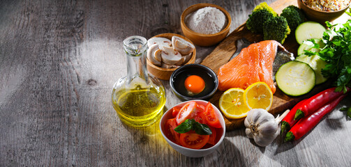 Fresh food ingredients prepared for cooking on a kitchen table