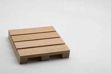 Wooden warehouse pallet. Wooden pallet front and angle view. Cargo loading and transportation..