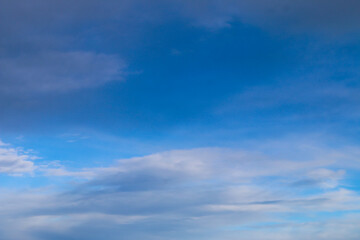 Naklejka na ściany i meble blue sky with dark white clouds